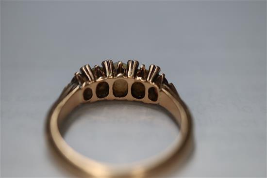 A Victorian 15ct, graduated white opal, split pearl and topaz? set half hoop ring, size O.